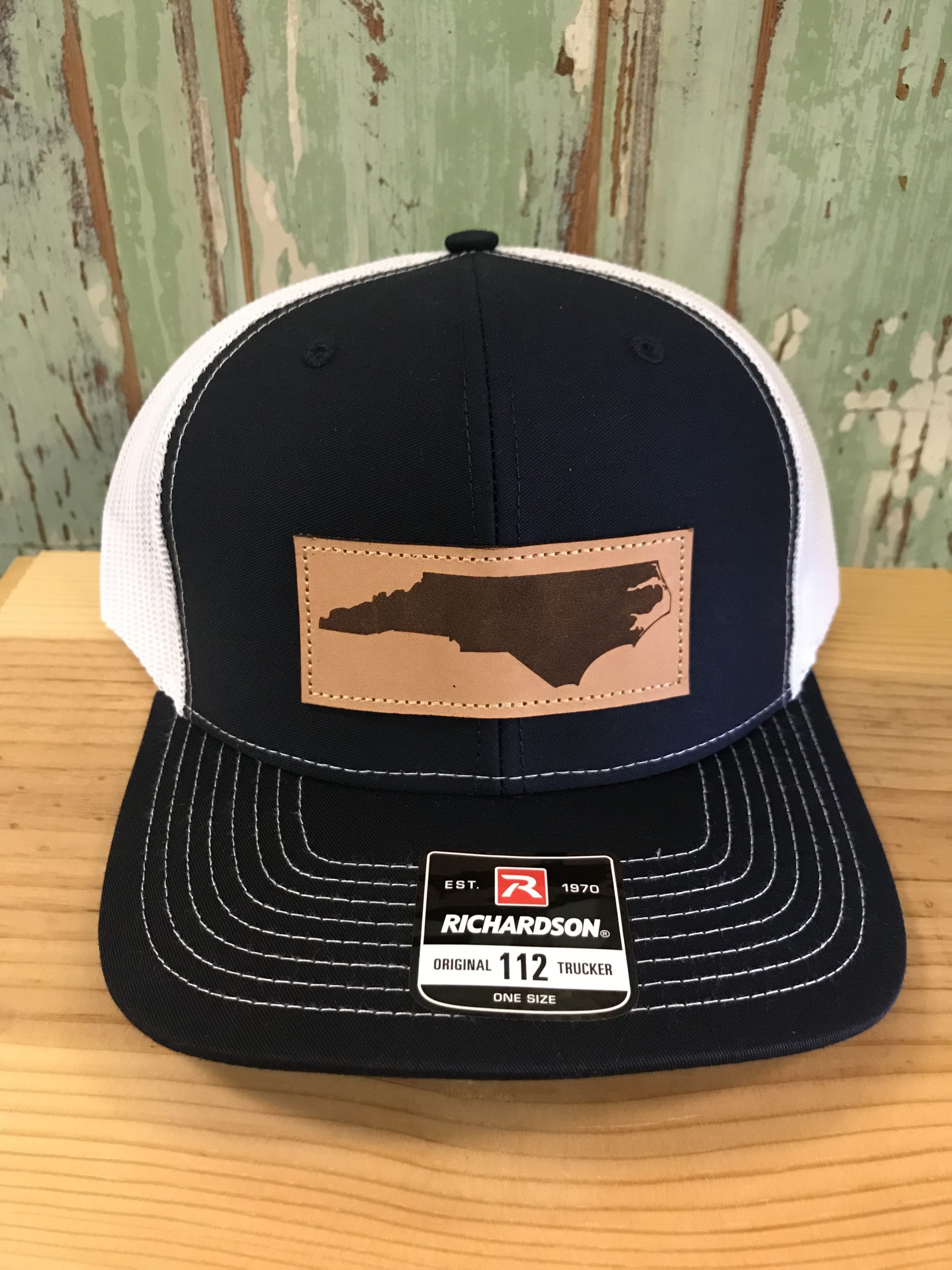 photo North Carolina Leather Patch Hat north carolina pride leather patch trucker hat silver white